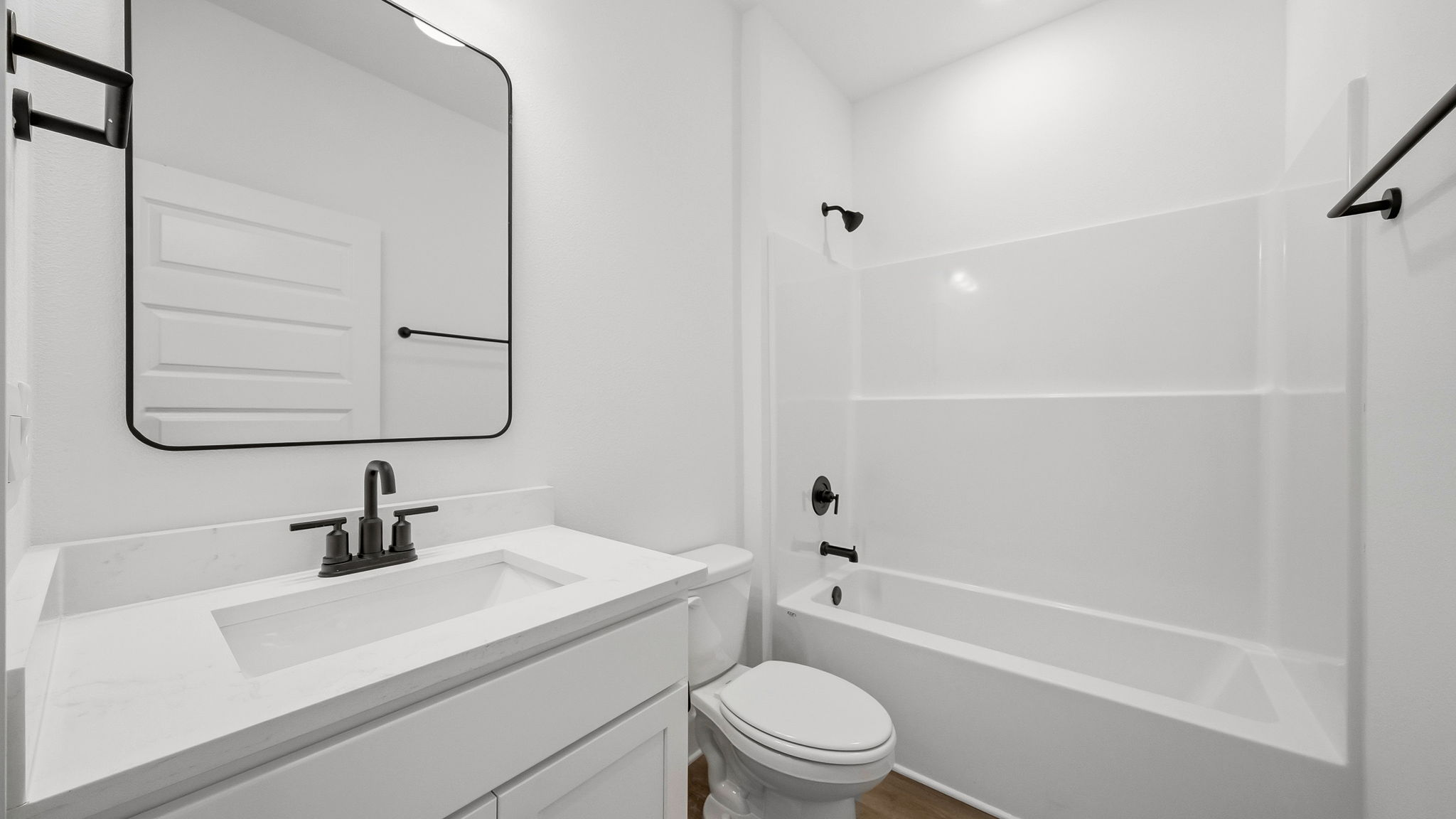 There is a shared bathroom with shower tub combination