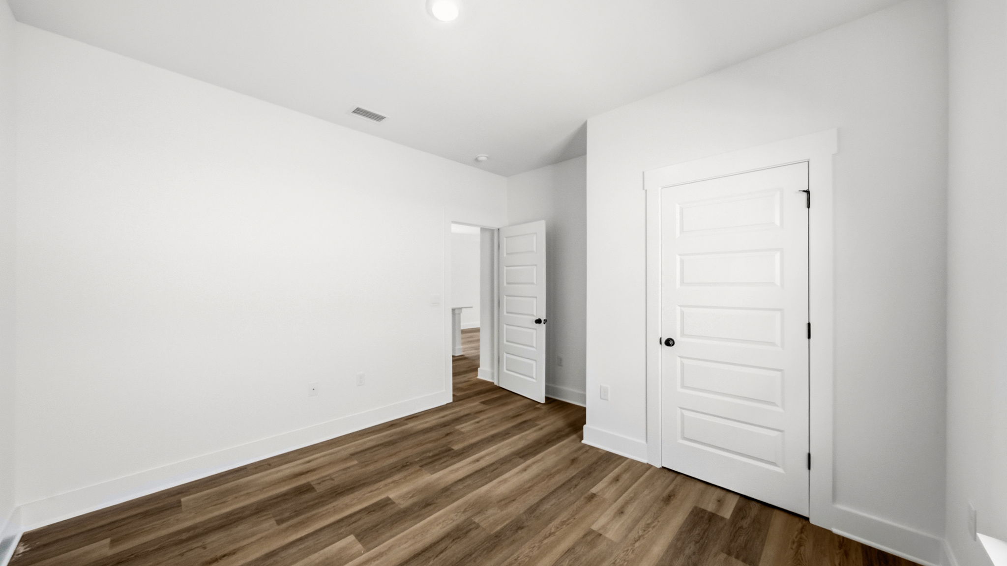 Guest bedroom three has EVP flooring