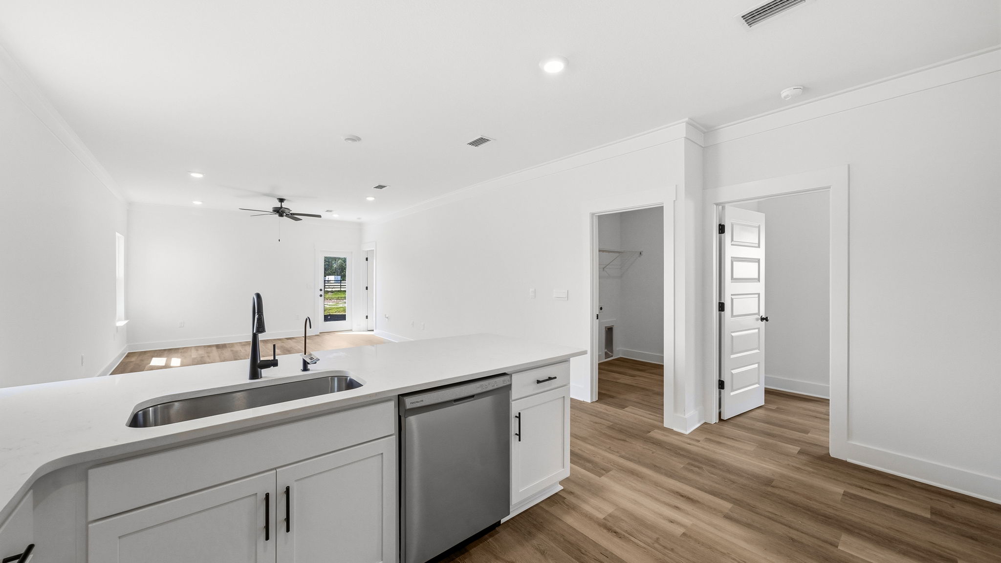 The kitchen is open to the living and dining areas