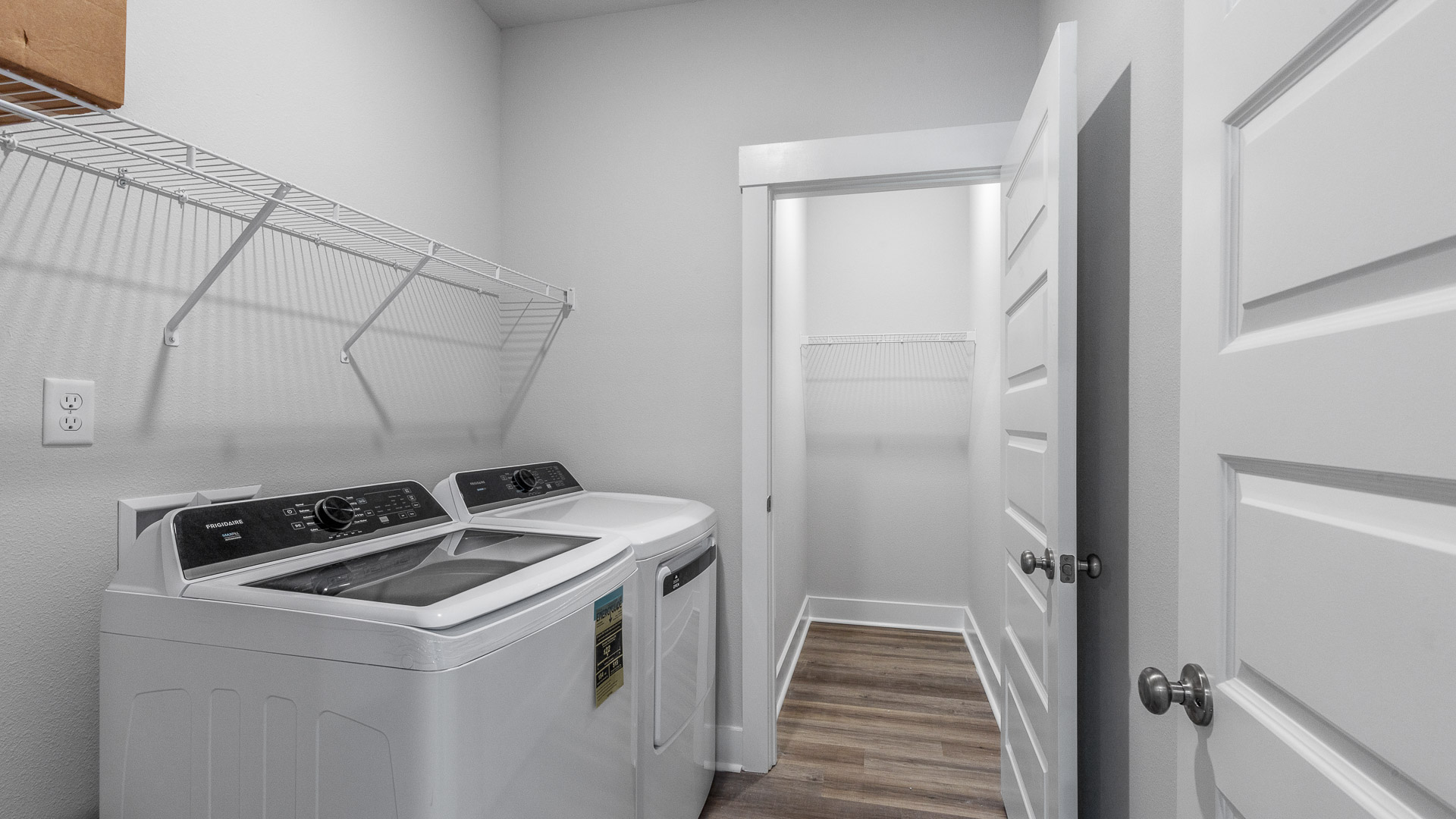 The laundry room of the Camilla has space for a full size washer and dryer as well as an additional storage room.