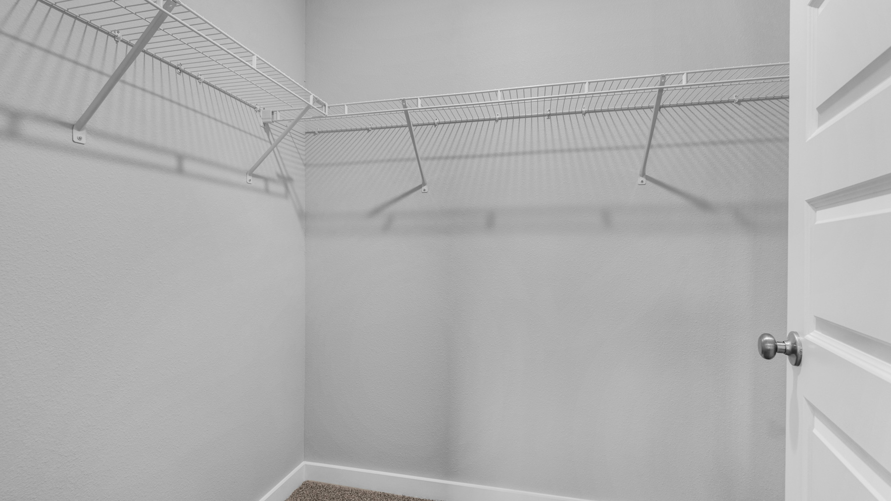 The closet in the primary bedroom is spacious