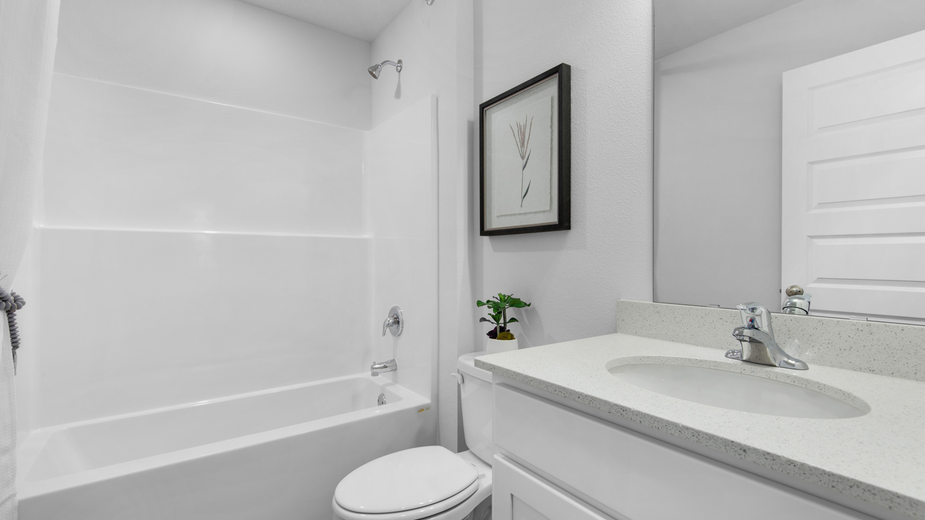 The shared bathroom has a single vanity and a shower tub combination