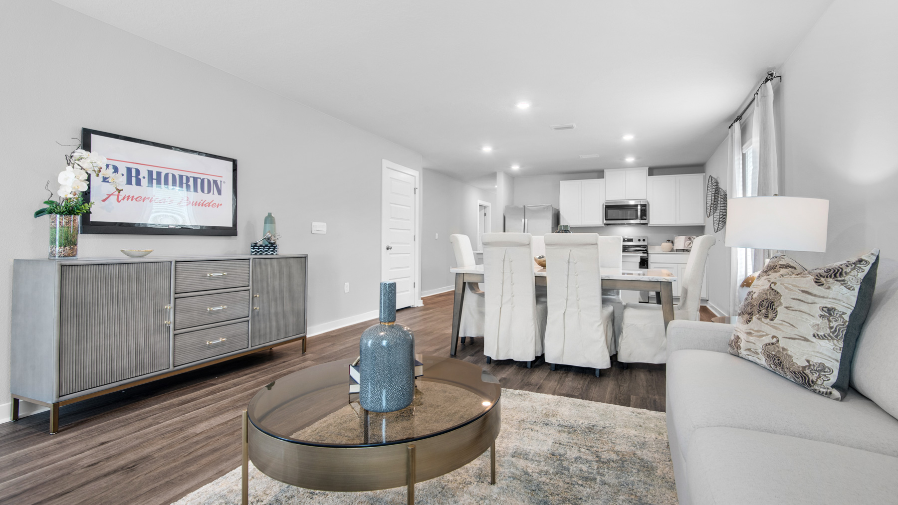 The living and dining areas have a seamless transition through the open concept design