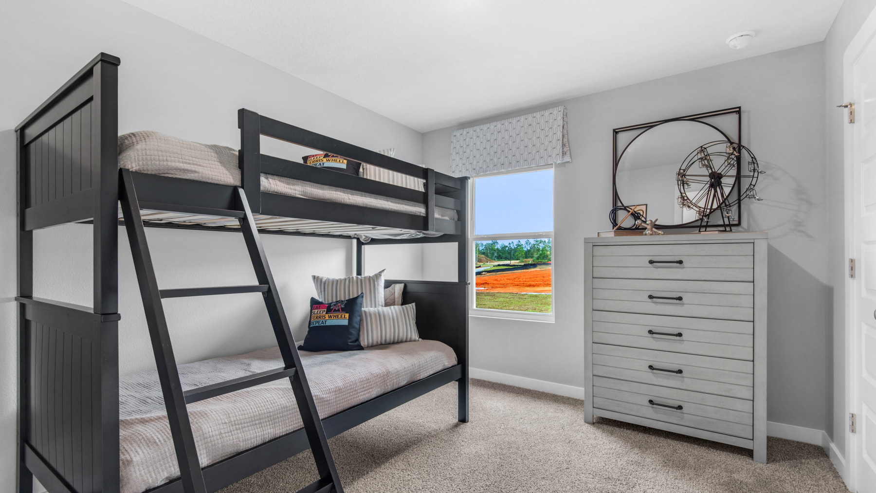 Guest bedroom two is located off the entry hall and has a shared bath with Guest Bedroom one