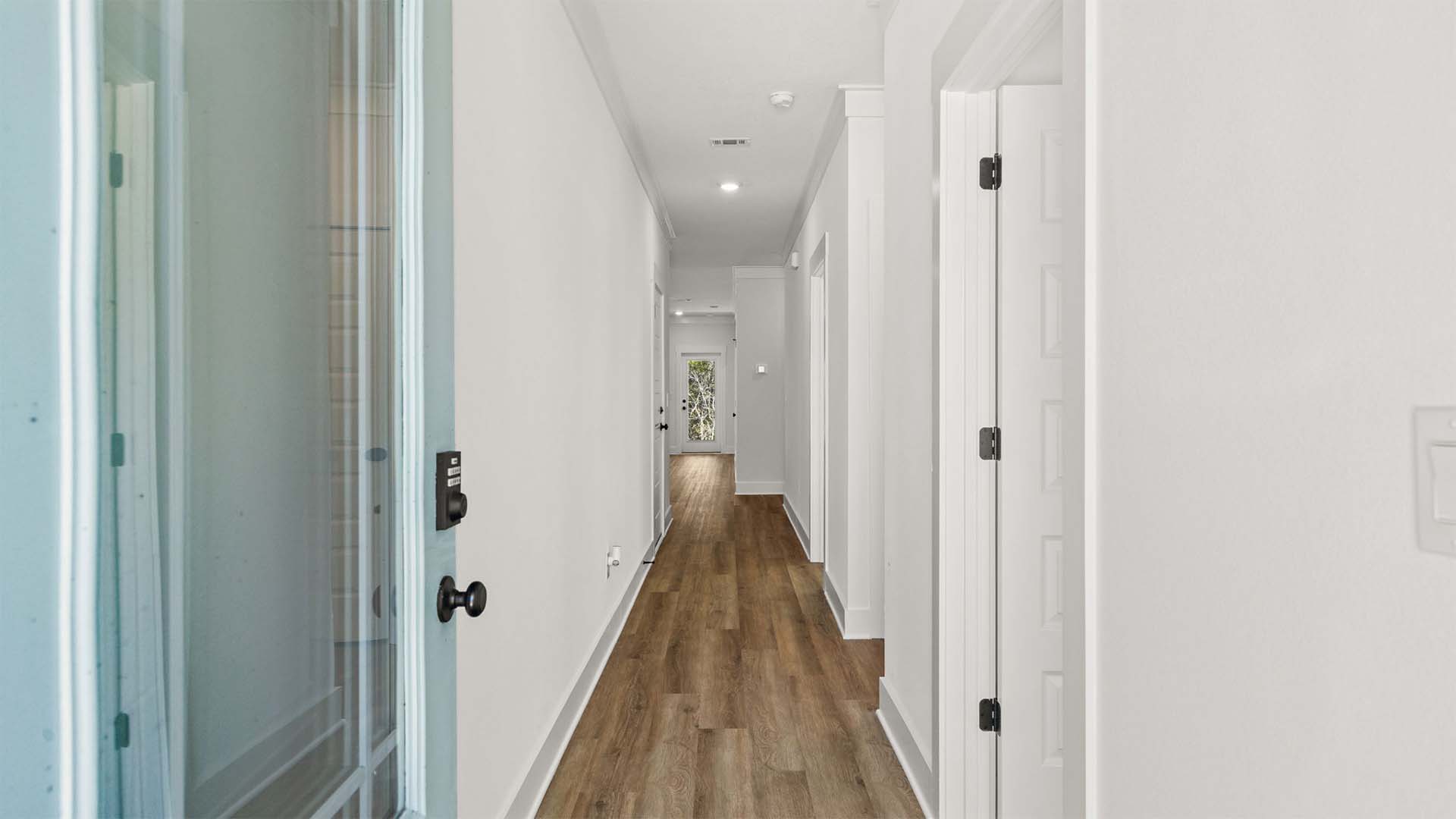 The Delilah entry to the home has a front door with partial glass for additional light