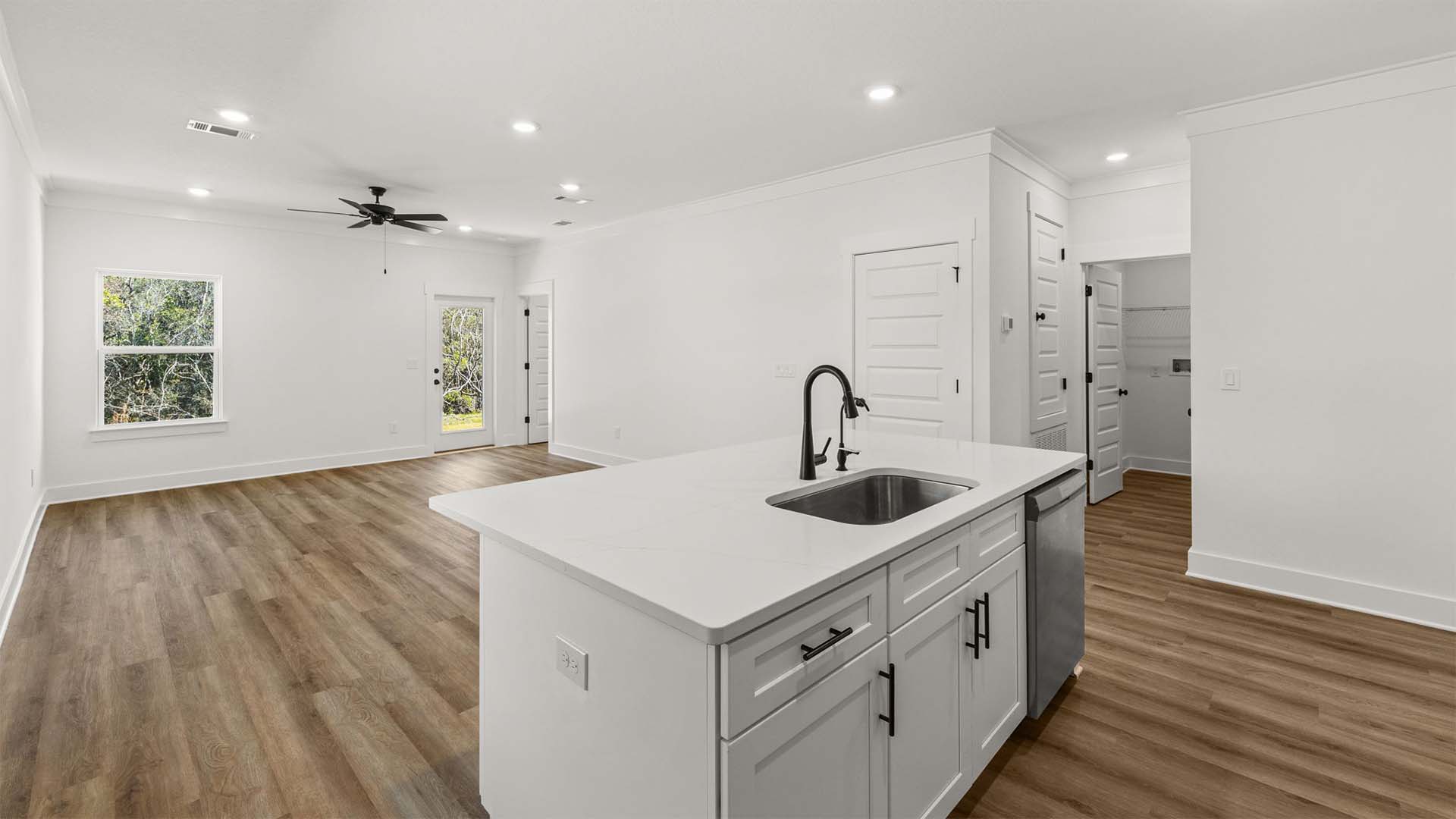 The kitchen looks out to the dining and living area