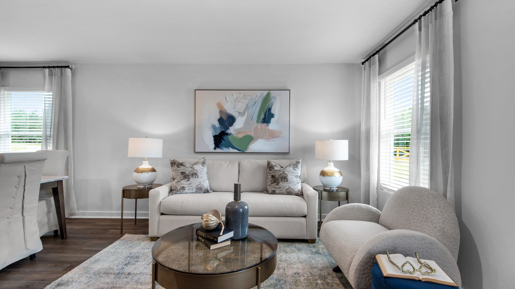 The living area is illuminated with natural light from the windows