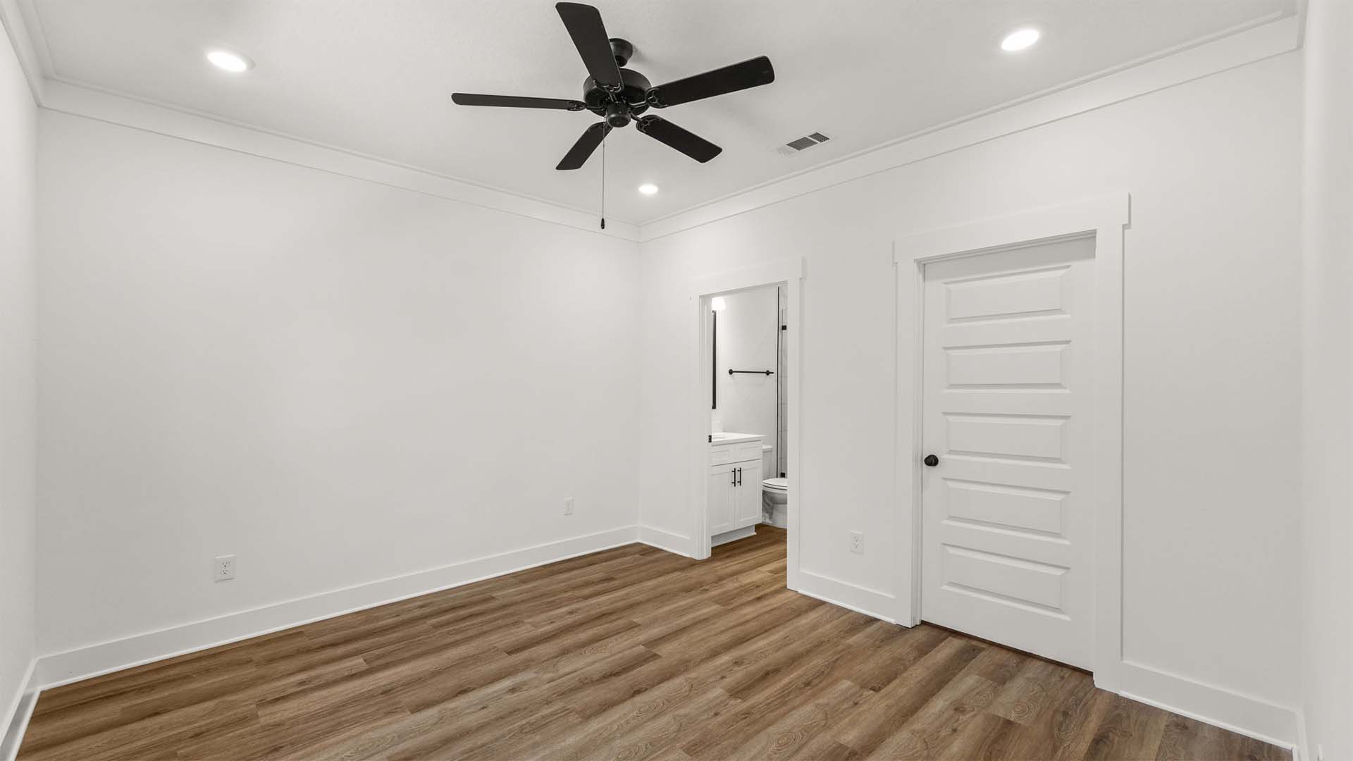 The primary bedroom has EVP flooring and a spacious closet