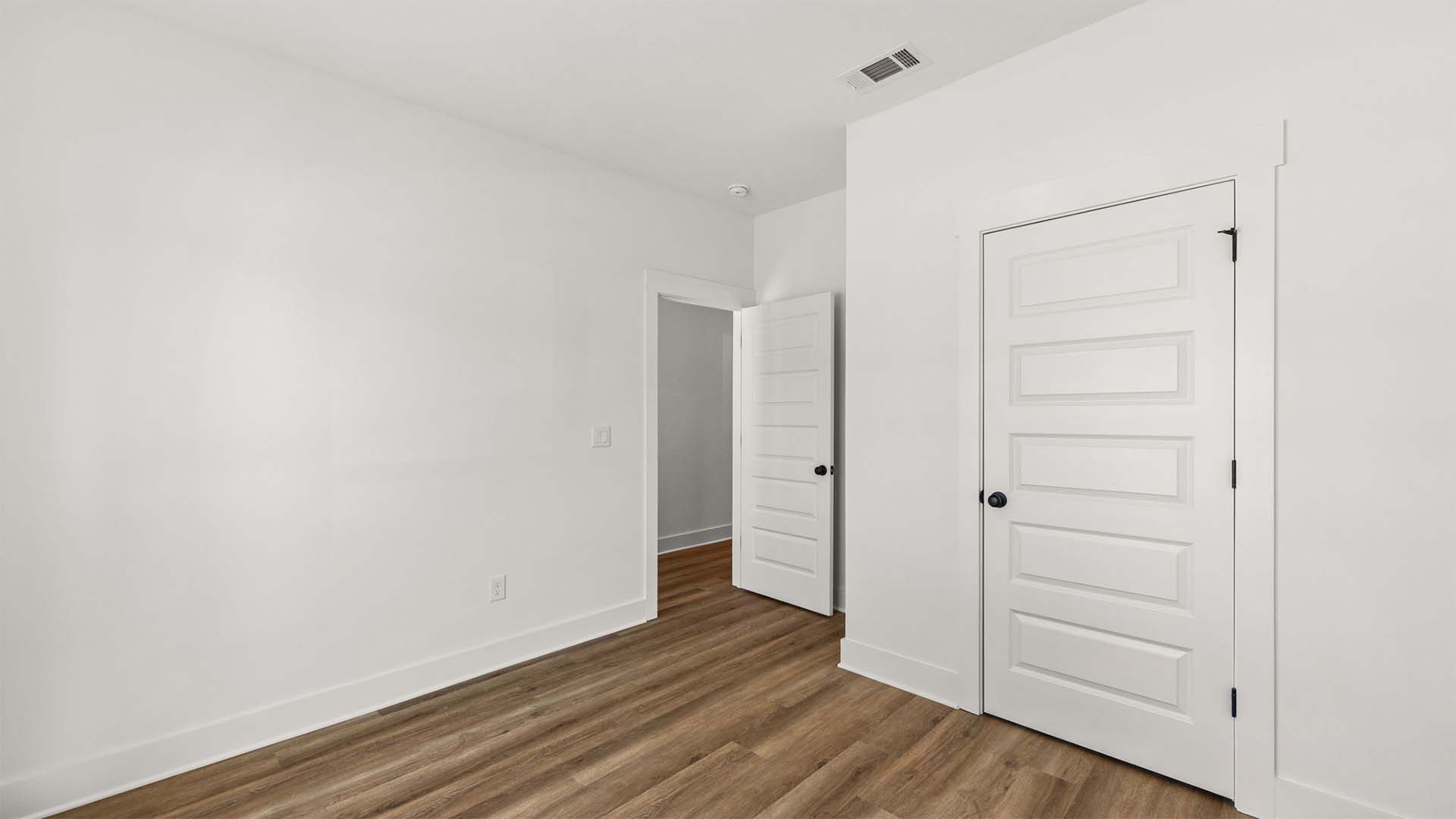 Guest bedroom has EVP flooring