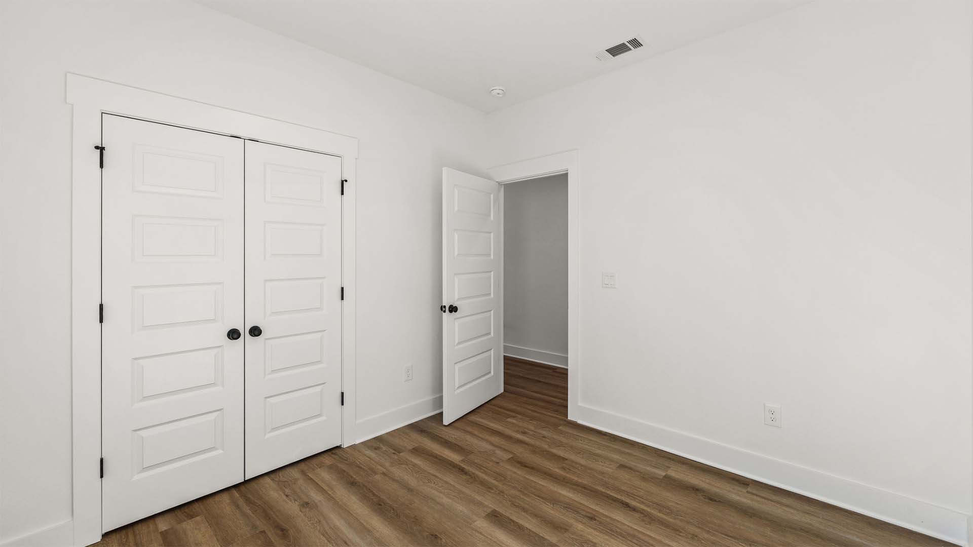 Guest bedrooms are separate by the shared bath