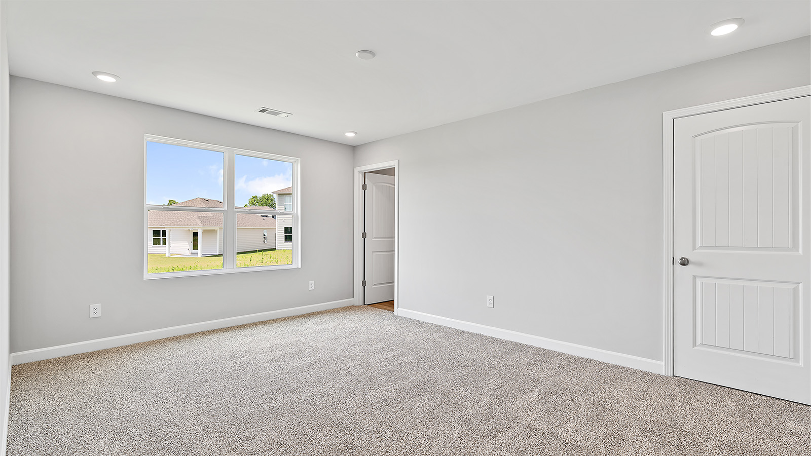 The primary bedroom is located at the back of the home off the living area