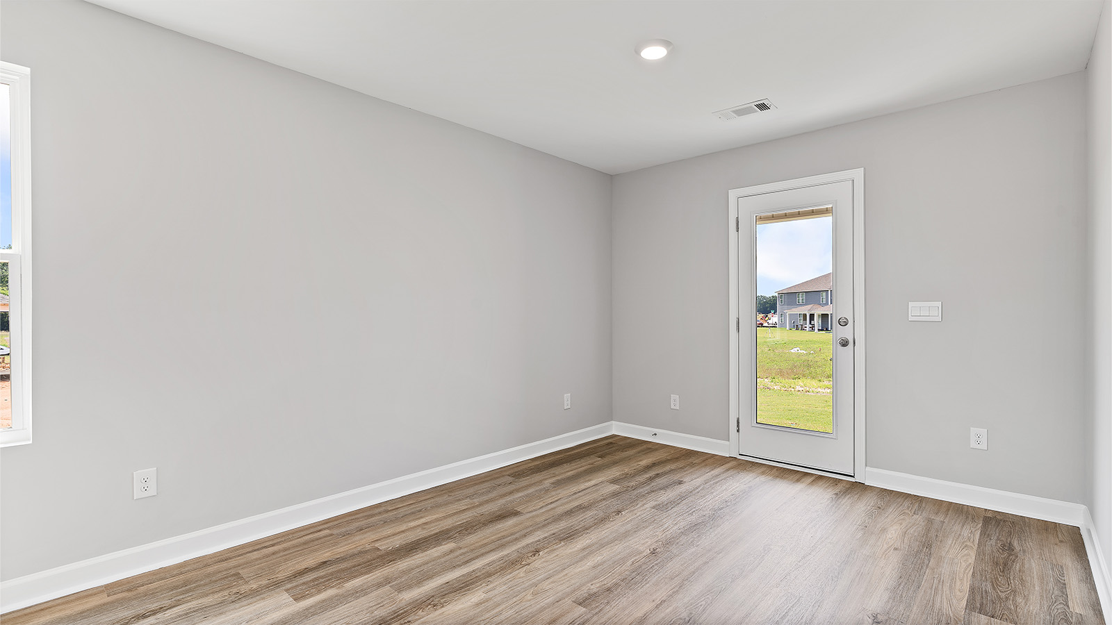 The living area provides access to the back patio