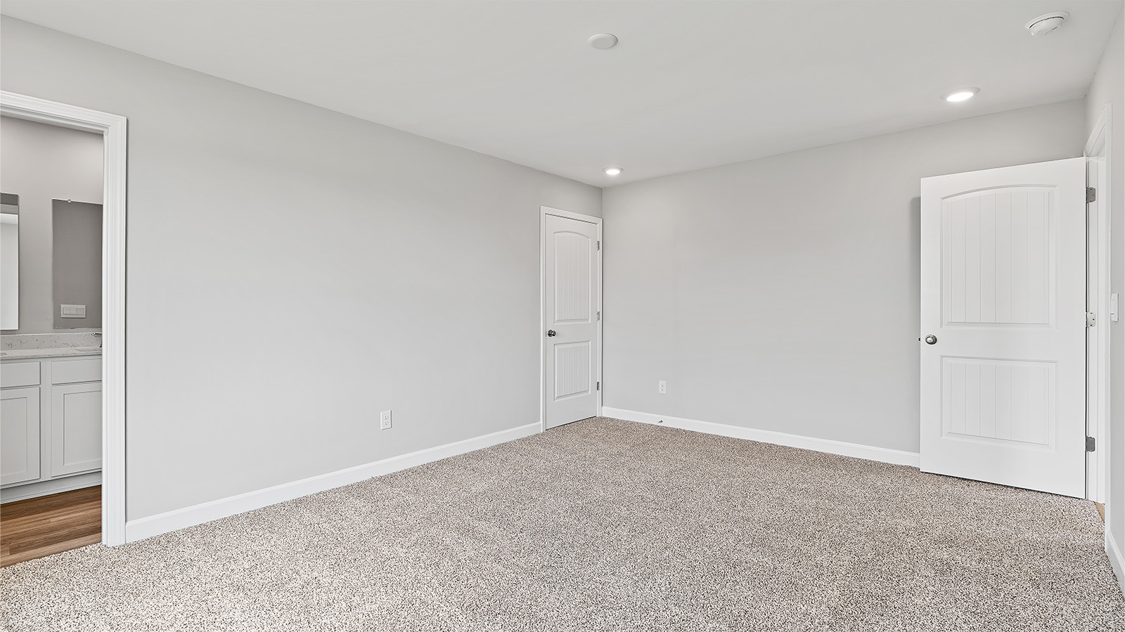 The primary bedroom offers a peaceful retreat at the end of the day