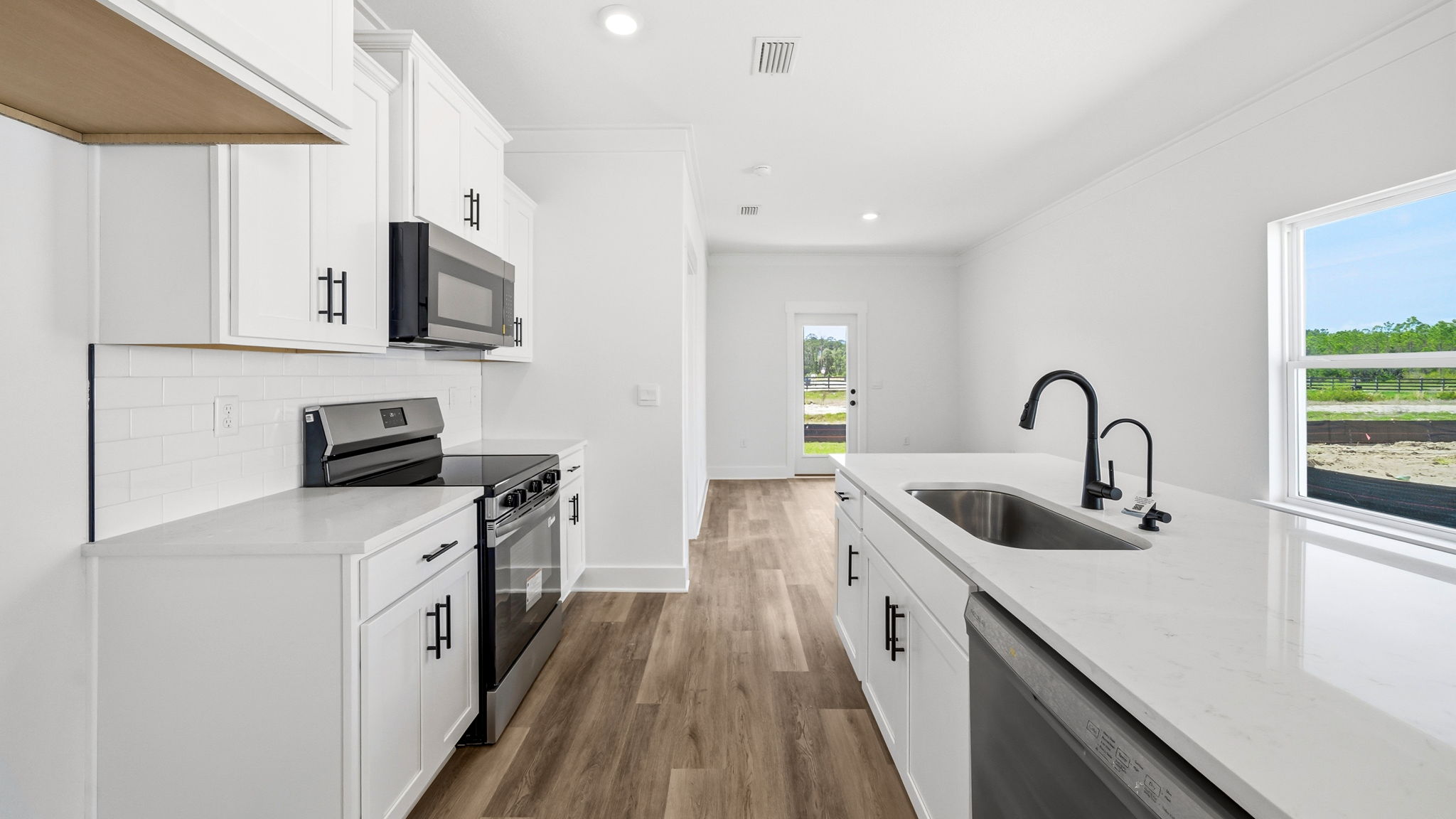 The kitchen has a center island with sink and dishwasher for easy meal prep and clean up