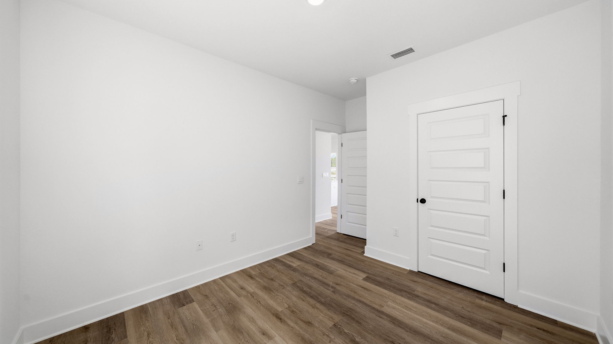 The guest bedrooms have EVP flooring