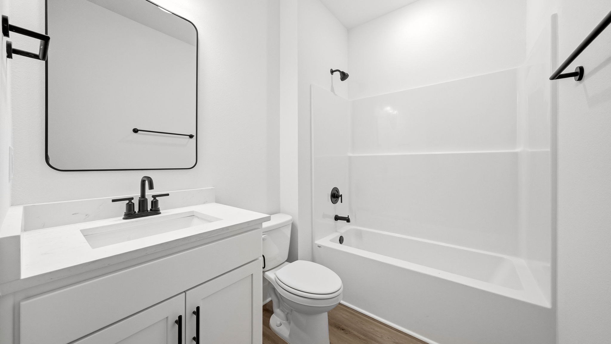 The guest bedrooms have a shared bath between with single vanity and shower tub combination