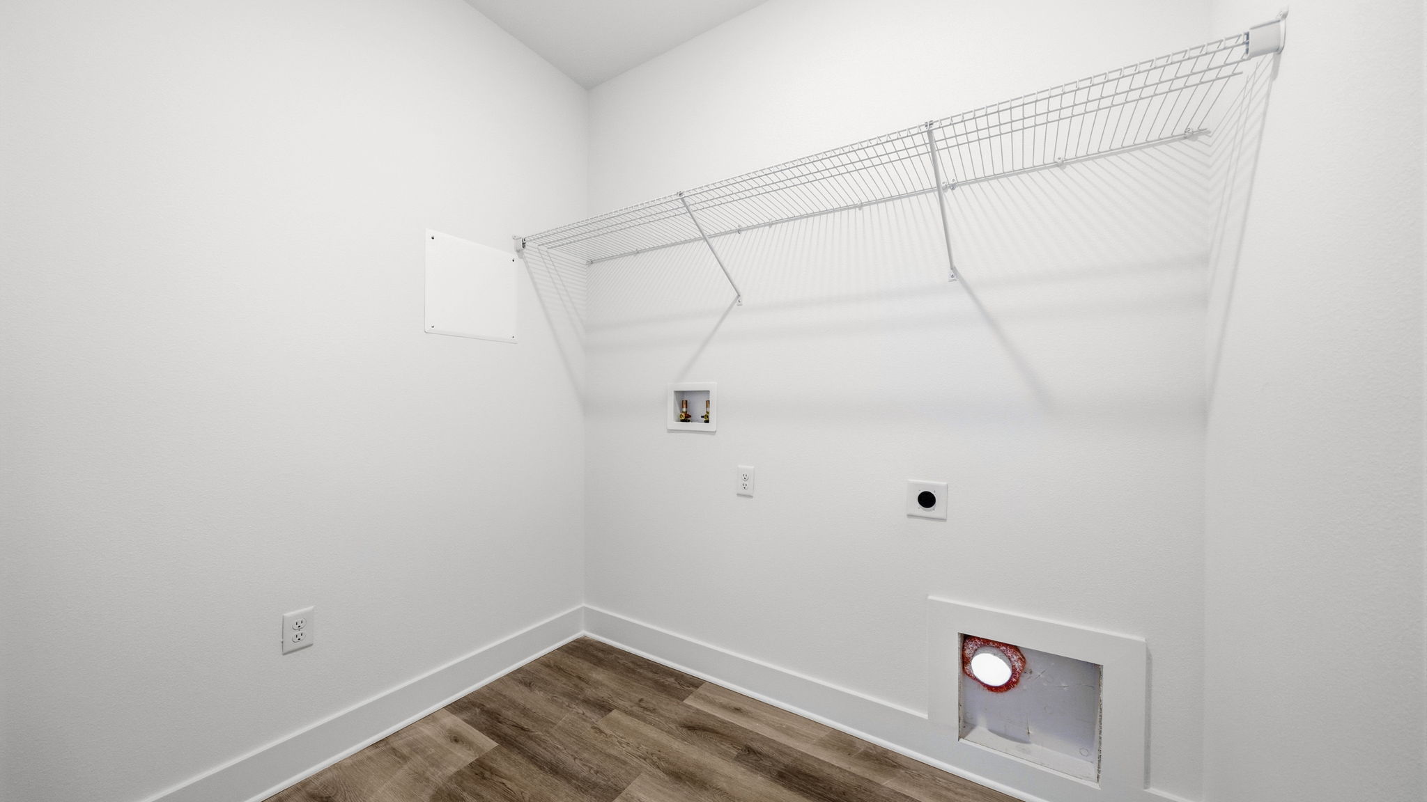 The laundry room is just off the front entry hall past the study