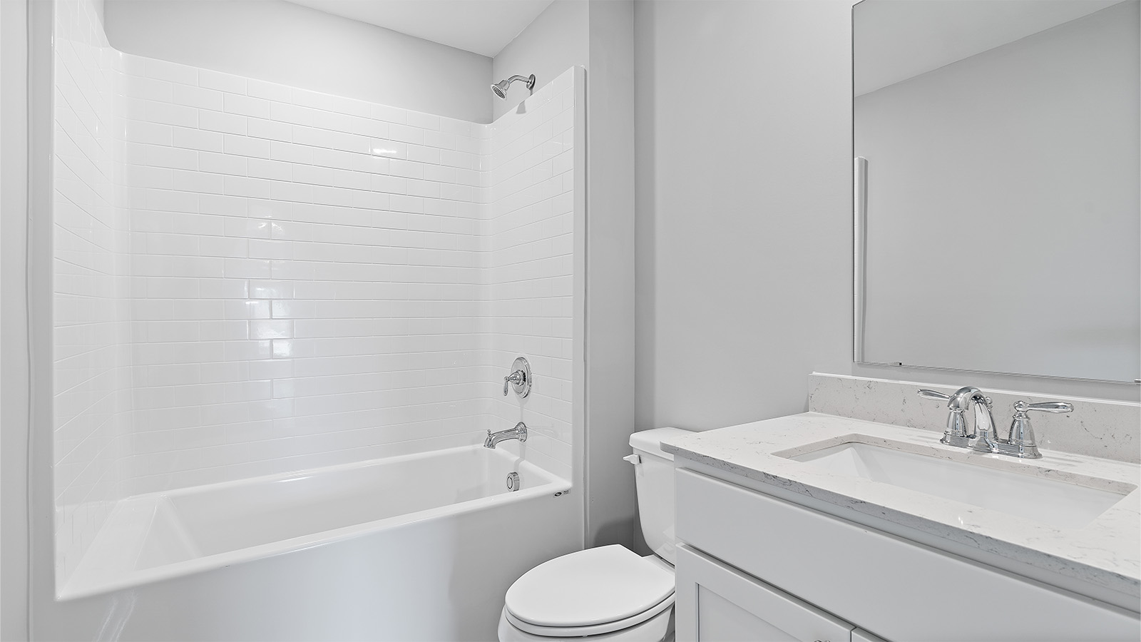 The shared bath has a single vanity with lower cabinetry and a shower tub combination