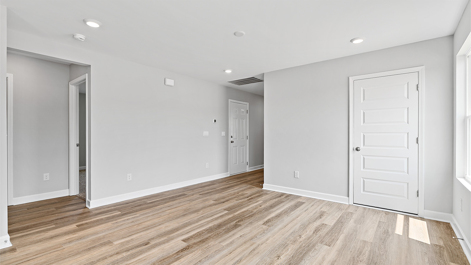 The dining area is illuminated by windows