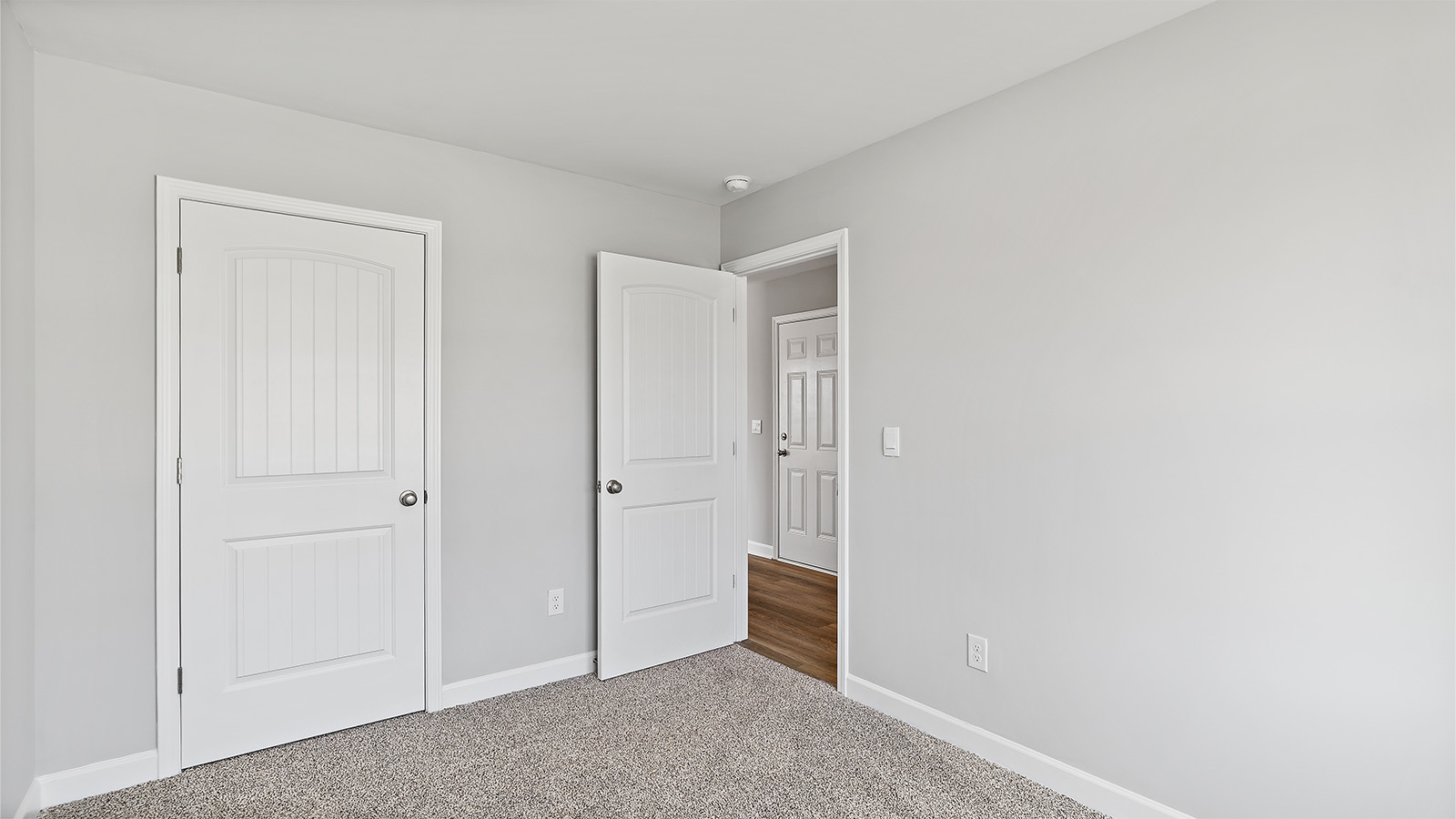 Guest bedroom two is located at the front of the home
