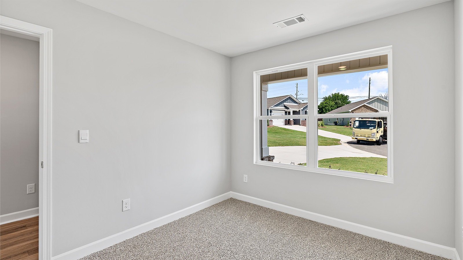 The study off the entry hall has natural light from the large window