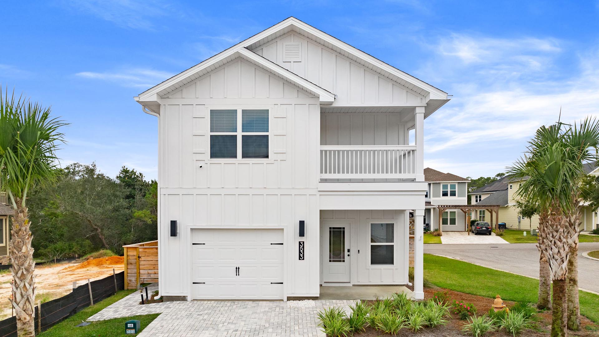 Similar Monroe floor plan at completion with white Hardie siding and a covered front entry