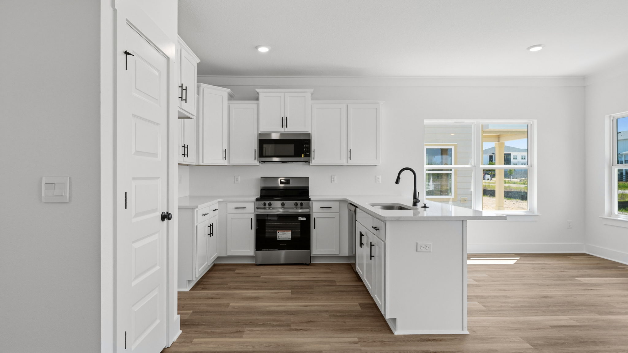 The kitchen has a peninsula bar with space for seating