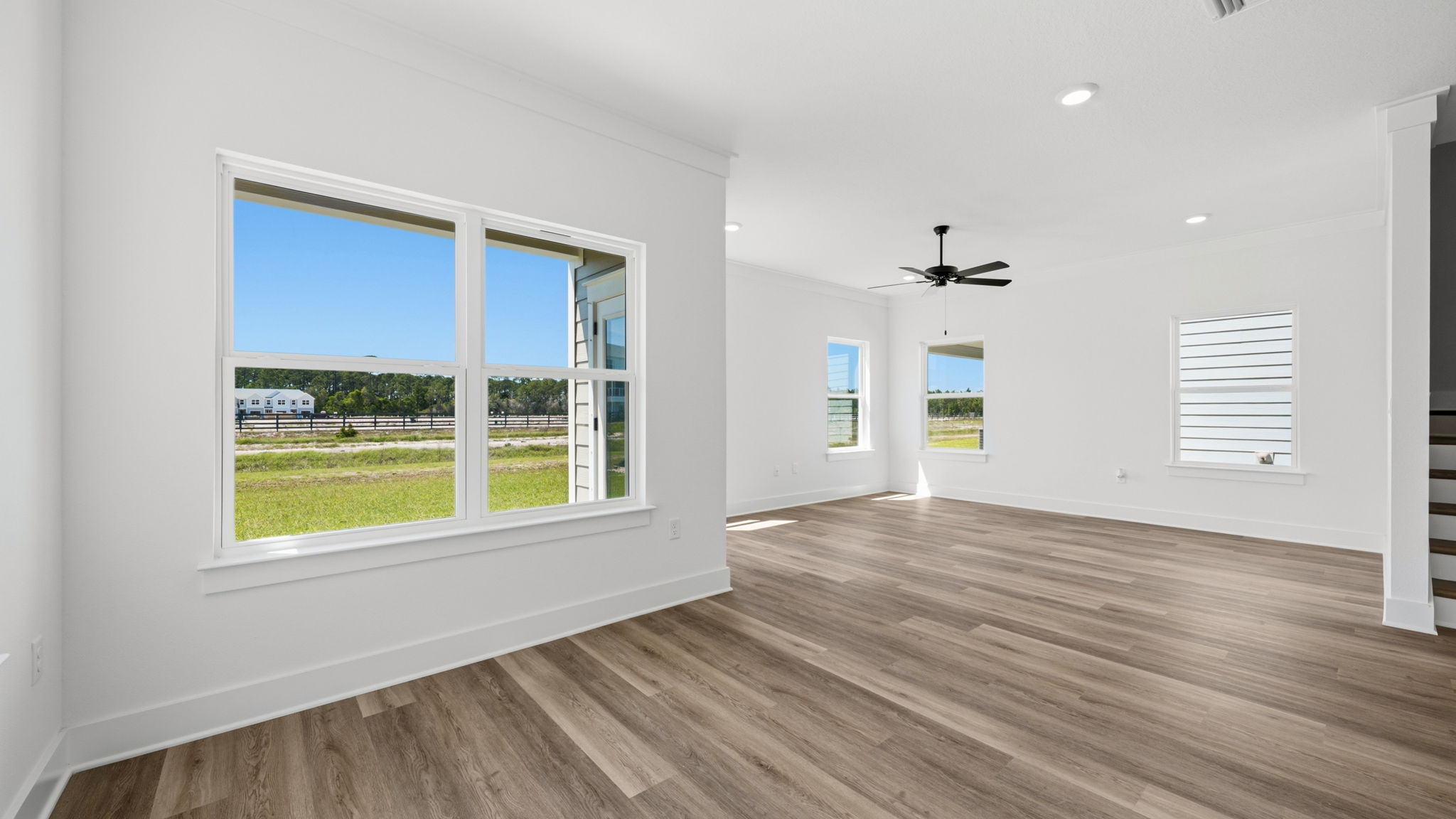 The dining area is illuminated by windows for natural light