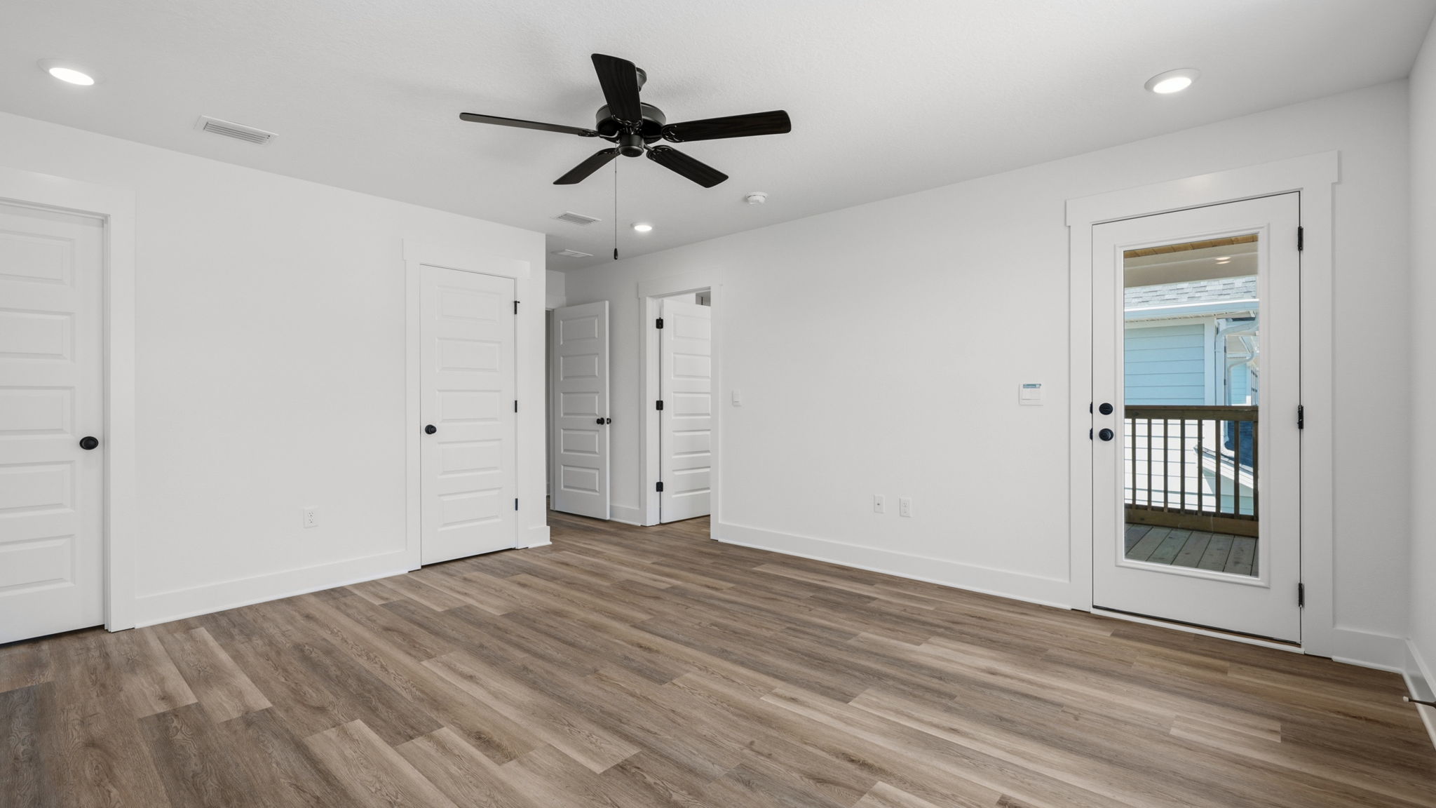 The primary bedroom is located away from the additional bedrooms for privacy