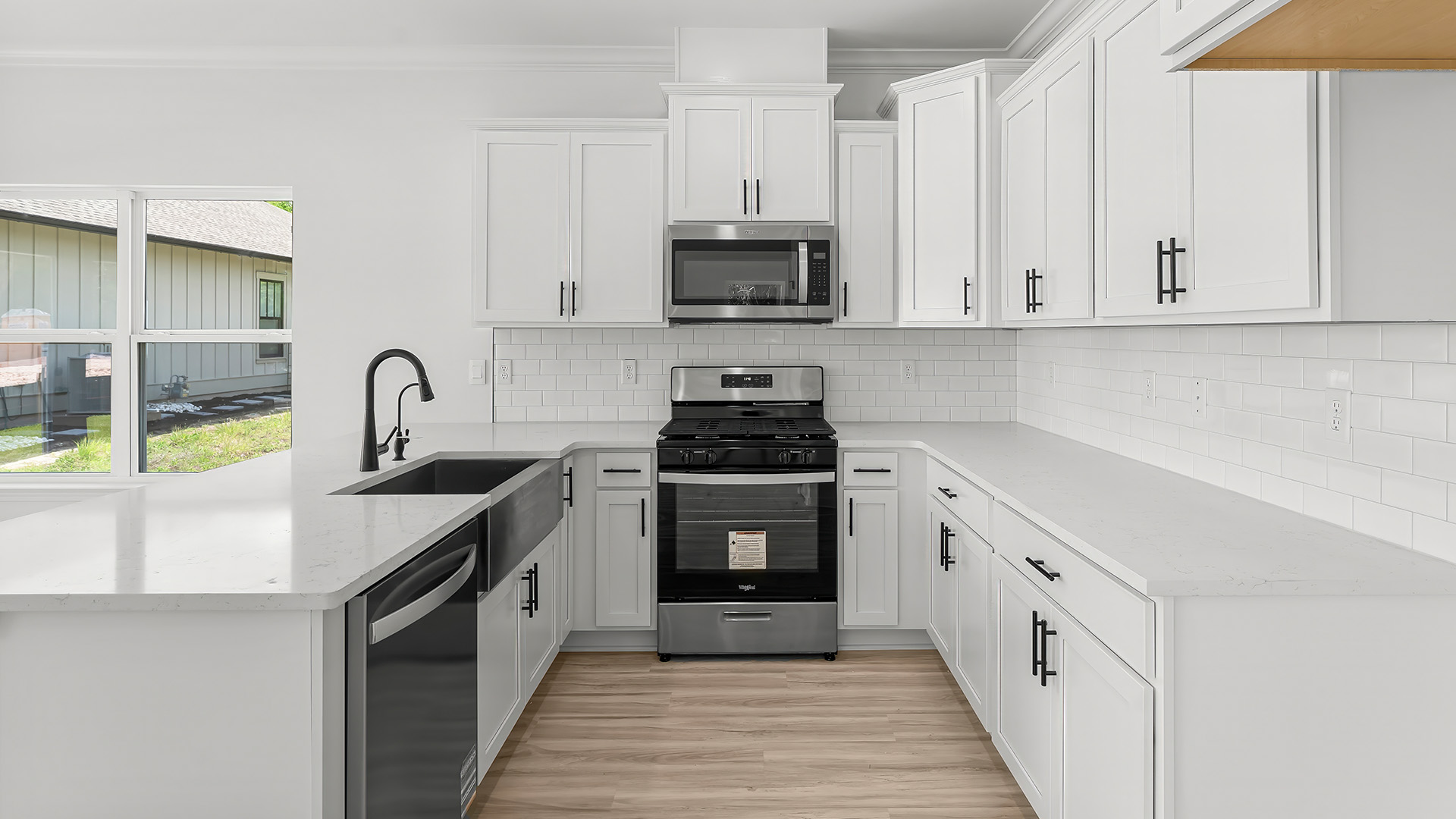 The peninsula bar holds the sink and dishwasher for easy meal service and clean up