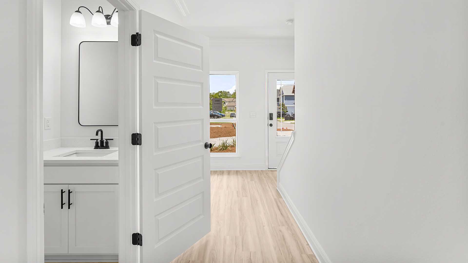 The entry hall features a half bath