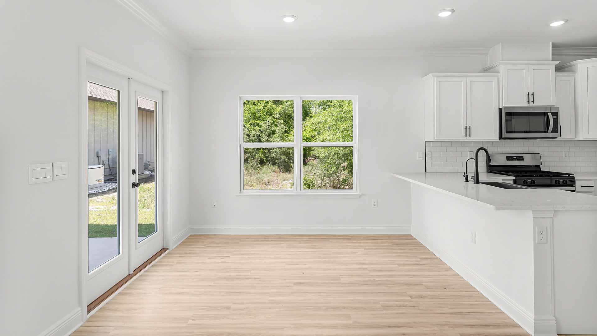 Spacious dining area illuminated by windows