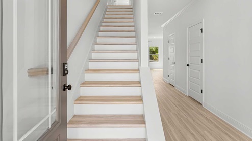 Entry to the Norfolk plan with stairs leading to the second level
