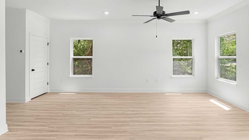 The primary bedroom is located overlooking the front of the home