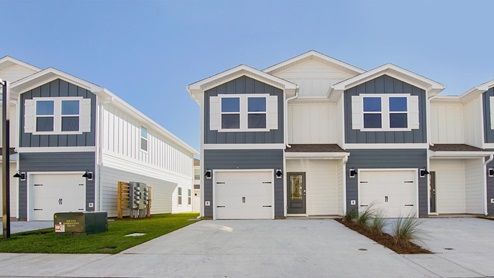 The Palm Townhome Exterior six unit building with two exterior units and four interior units