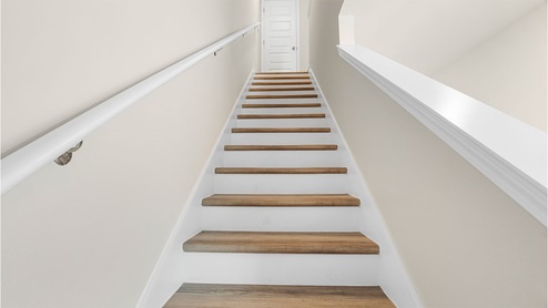 EVP treads on stairs leading to the second level
