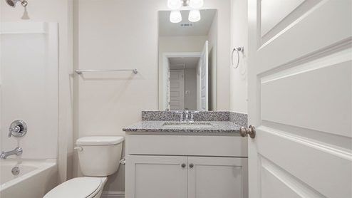 The Palm townhome has a shared bath with shower and tub combination