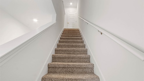 Stairs leading to second floor living space