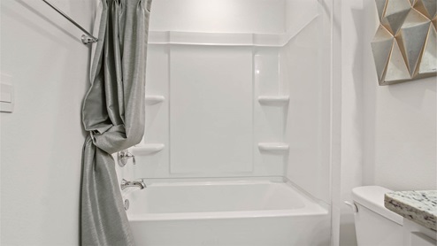 Shared bath on second level with shower/tub combo