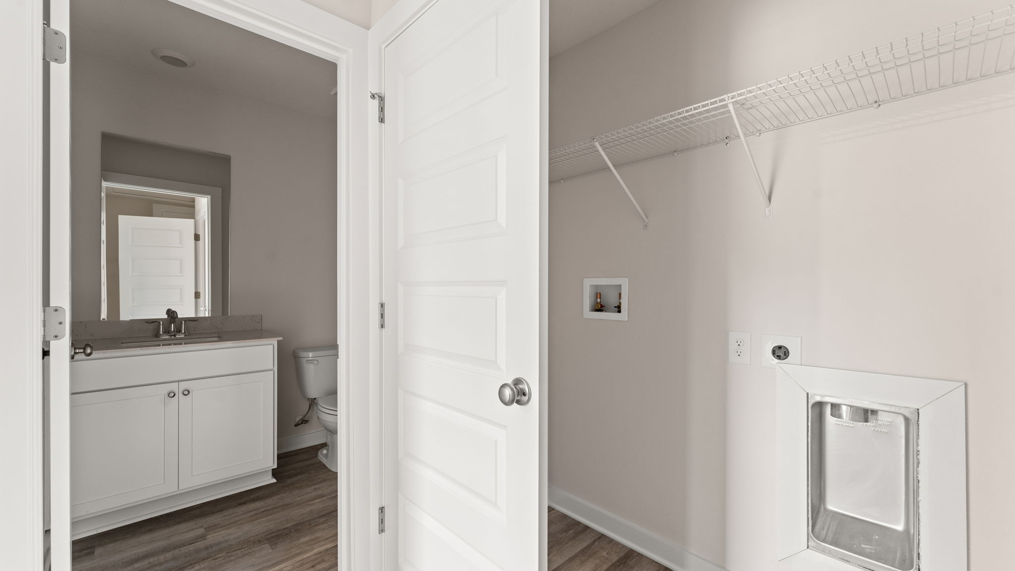 There is a laundry area across from the guest bedrooms has a shower tub combination
