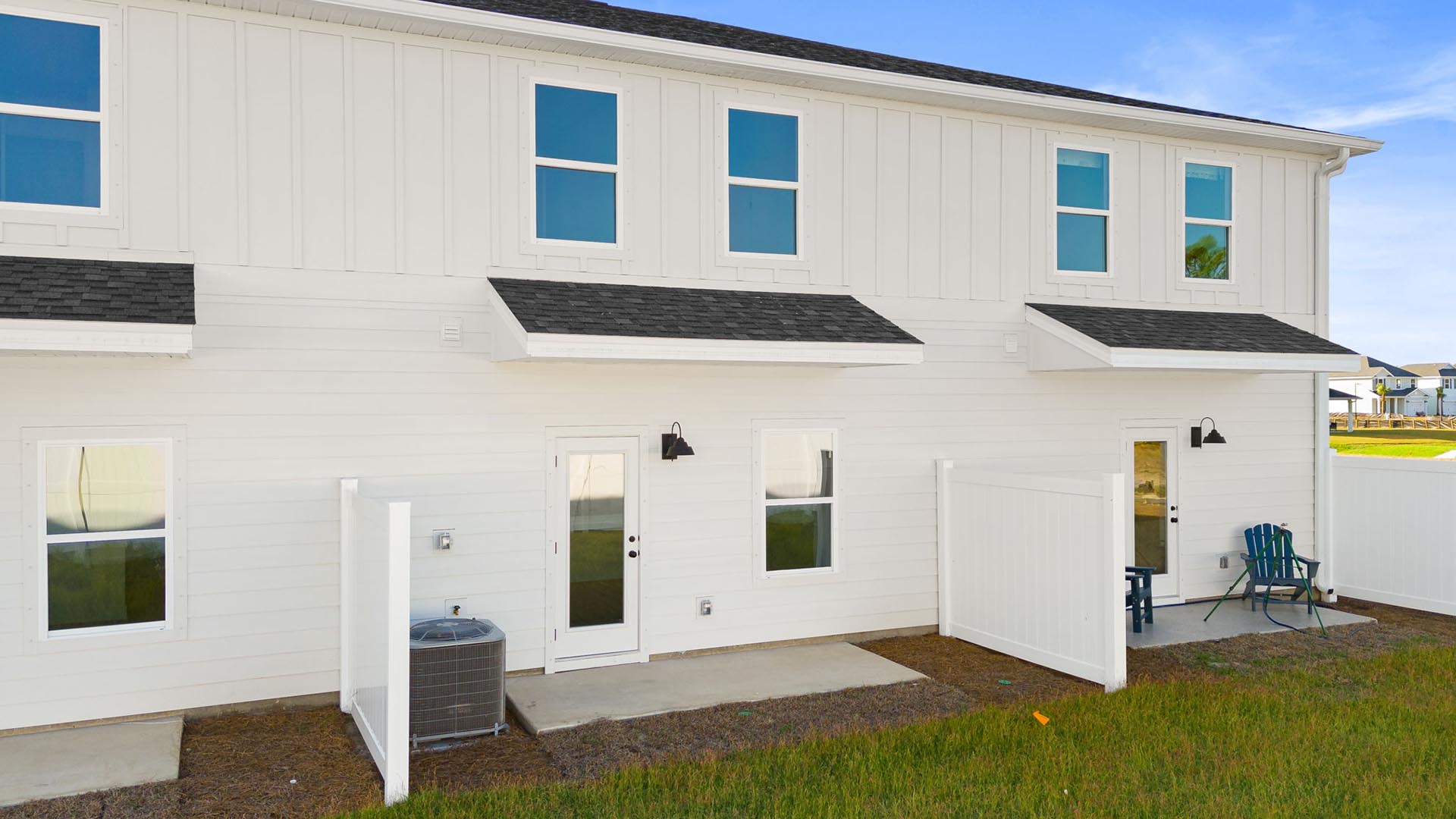The back of the townhomes have a partition between each unit