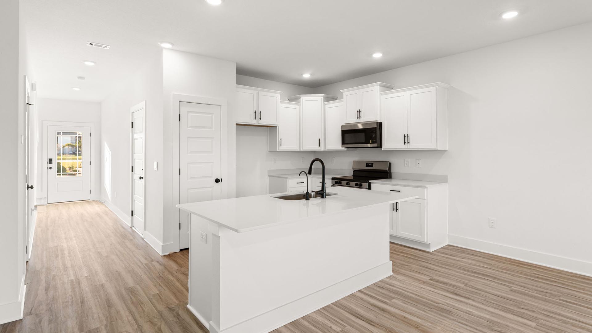 The kitchen has a center island with quartz countertops