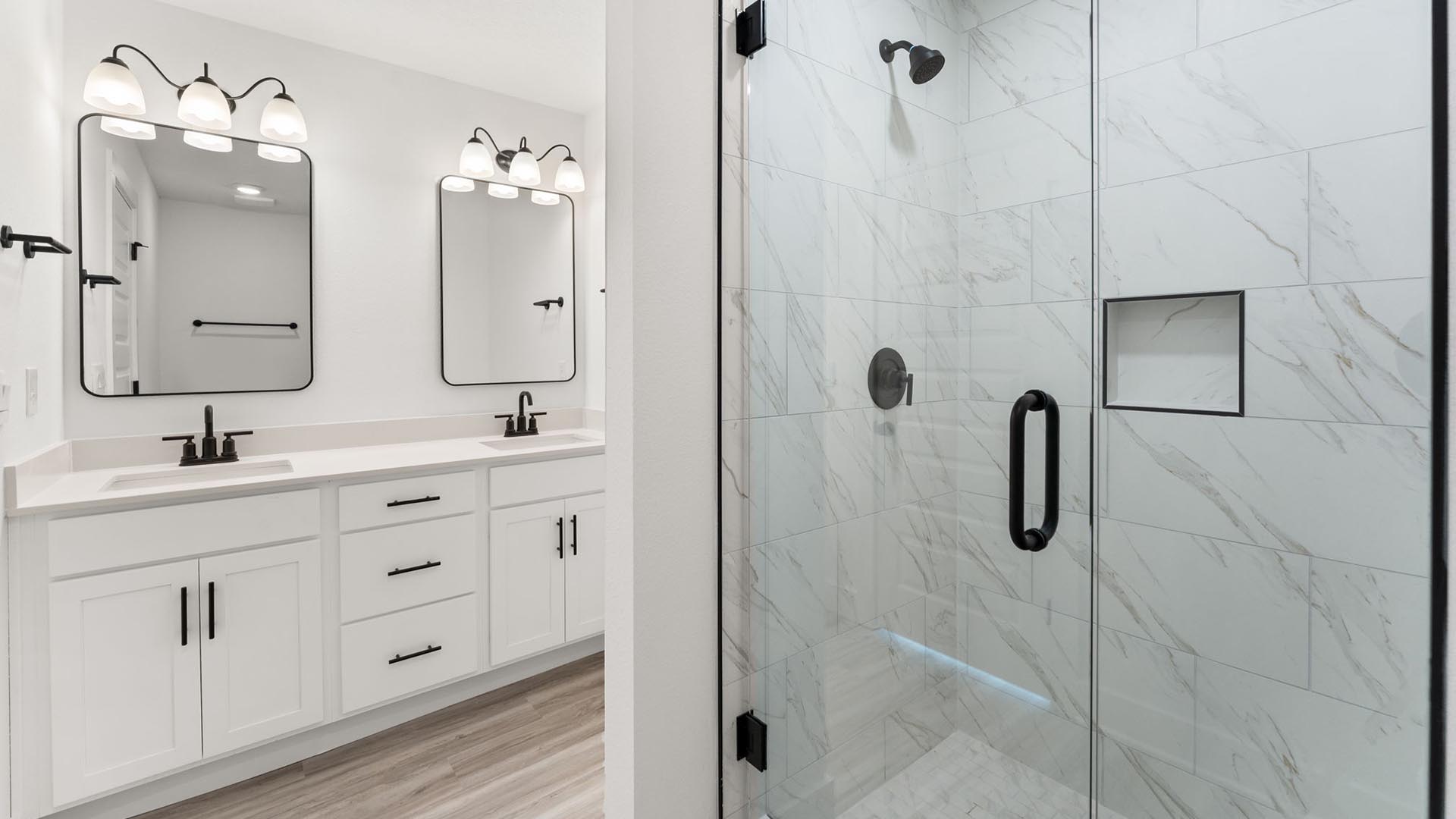 The primary bathroom has matte black plumbing fixtures