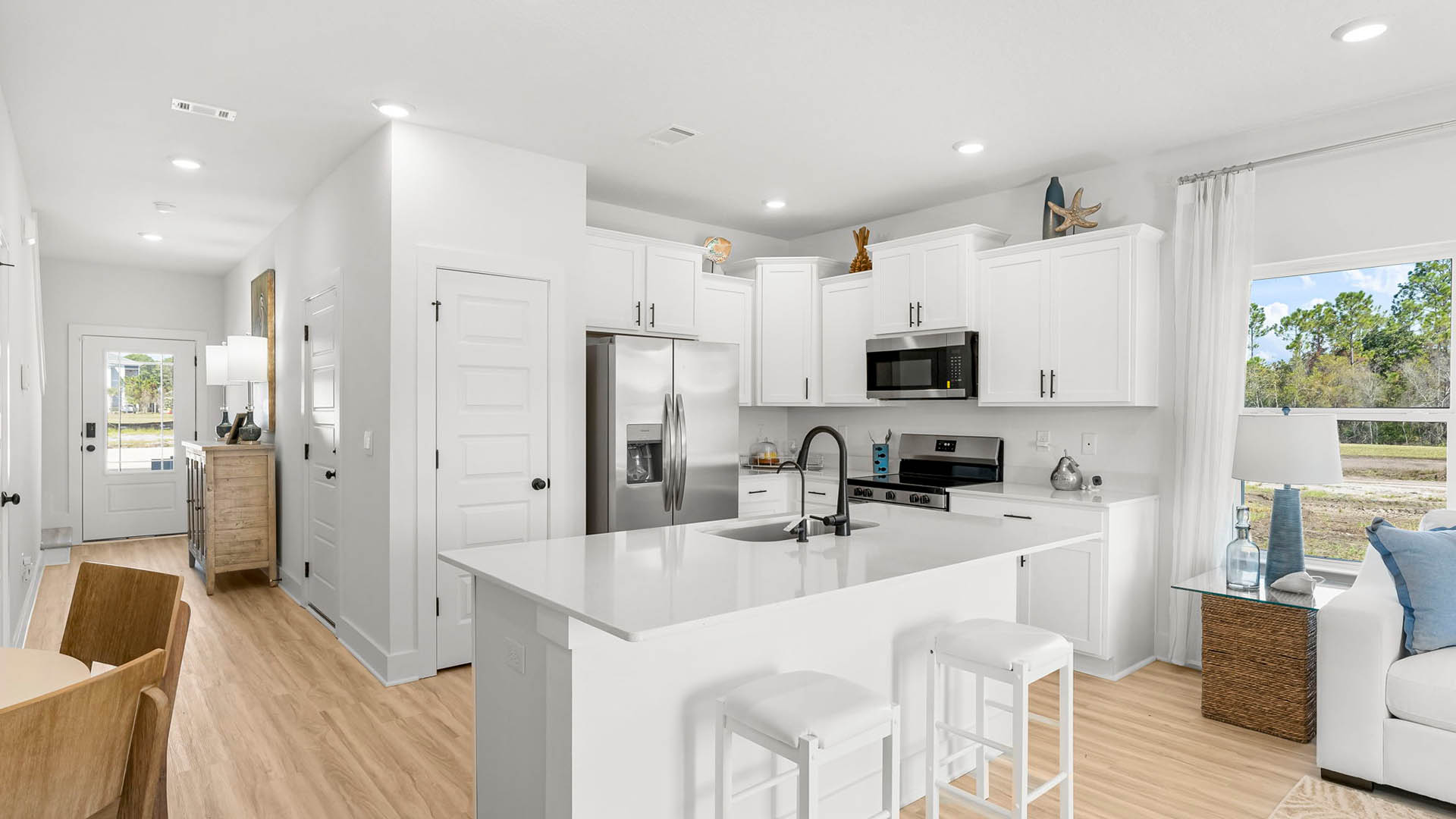 The interior of this townhome includes a spacious open kitchen with center island