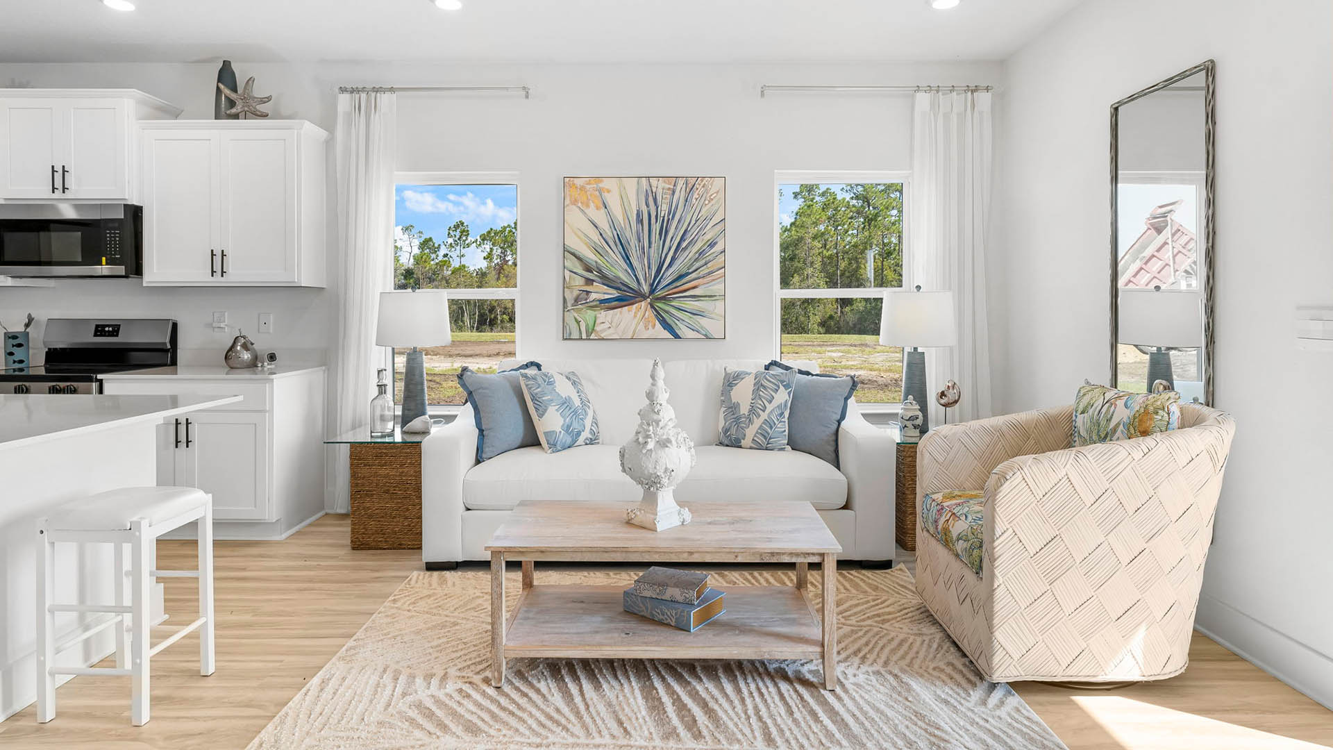 The living area is illuminated by natural light from the windows of the end unit