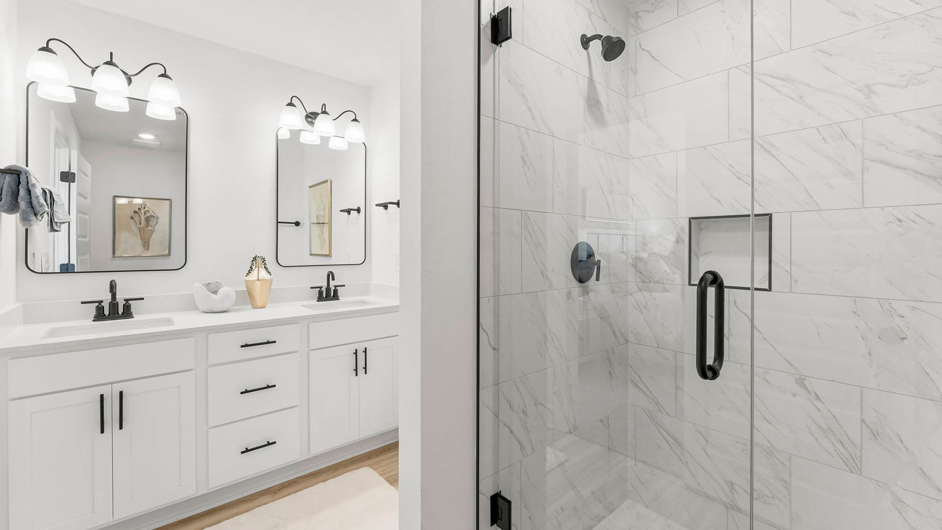 Upstairs is the primary bedroom with luxurious ensuite bathroom