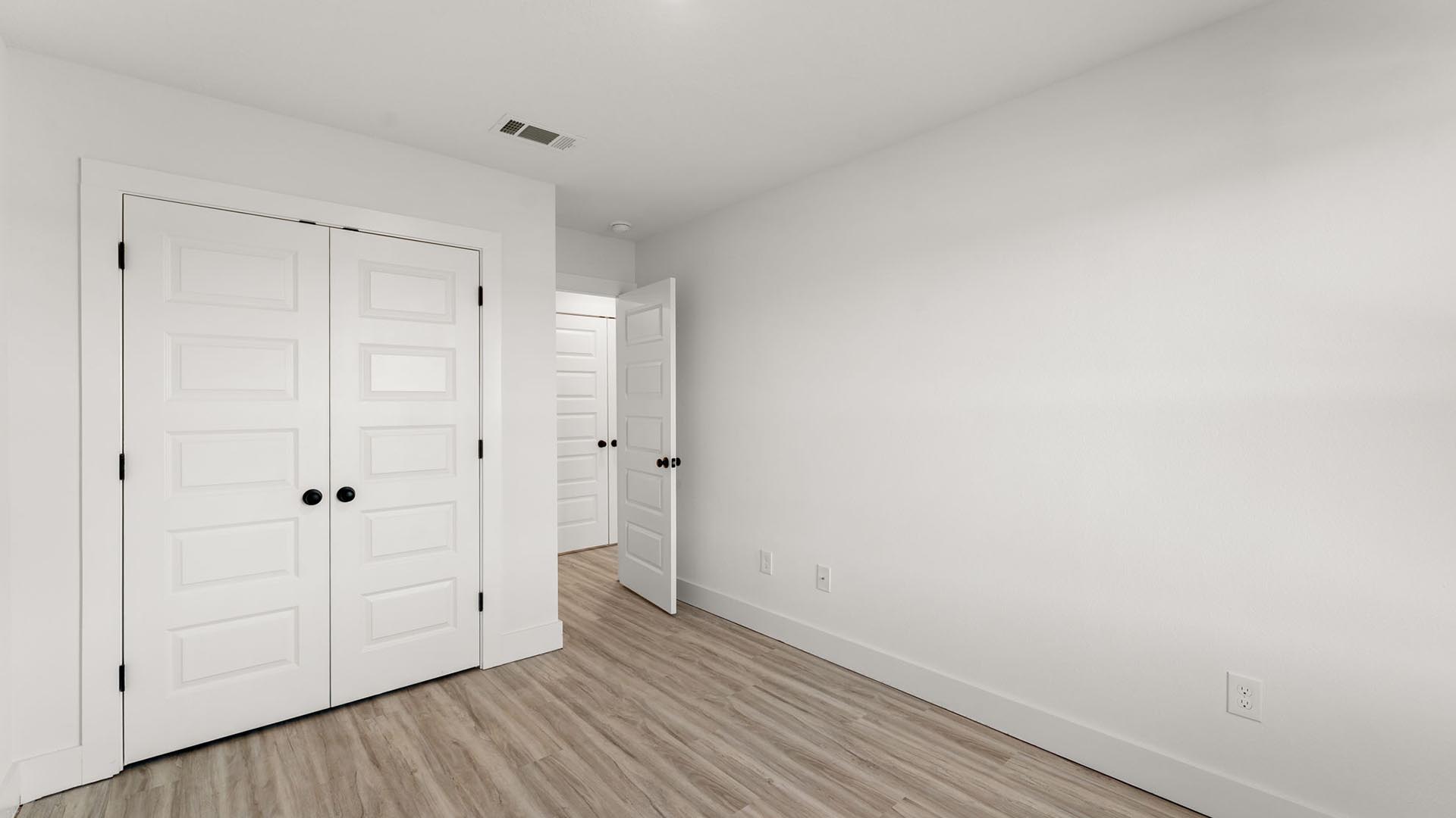 Guest bedroom one has EVP flooring