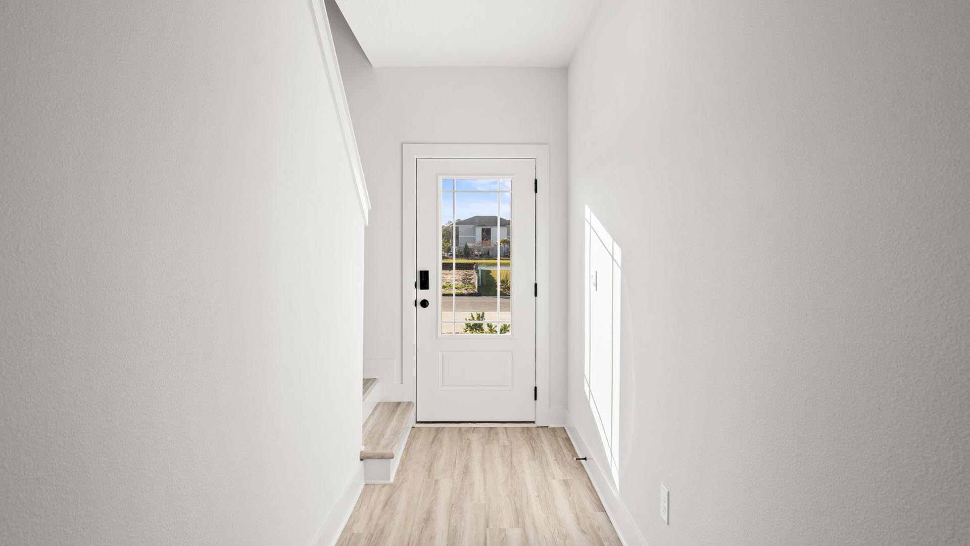 The entry hall has EVP flooring leading to the living area