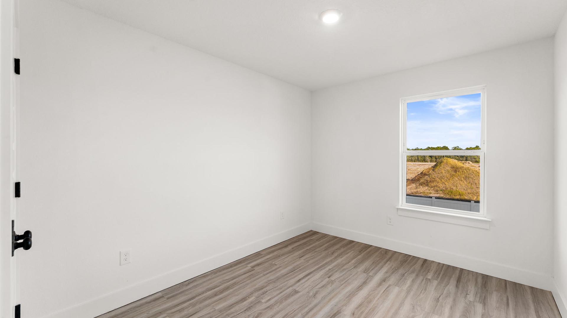 Guest bedroom two has EVP flooring