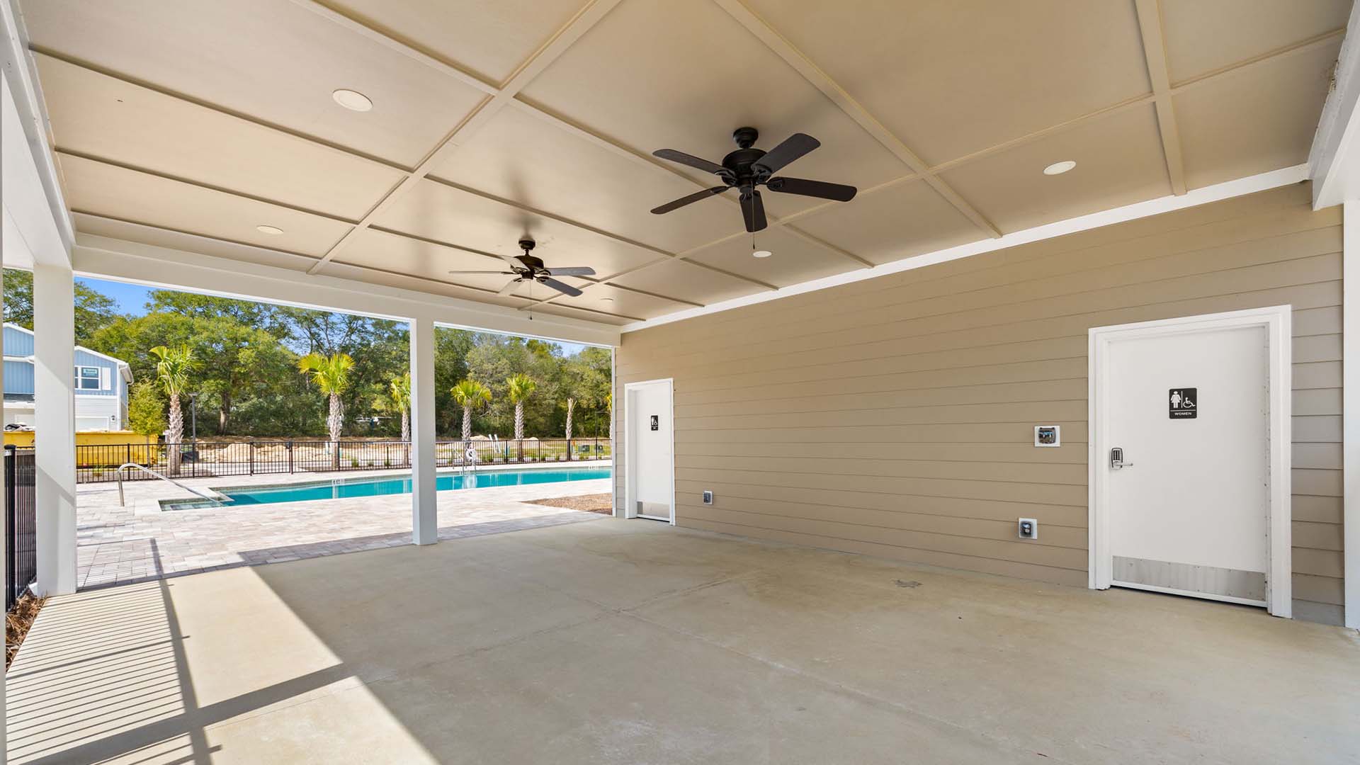 This is the covered area by the pool, offering a space for shade and picnics